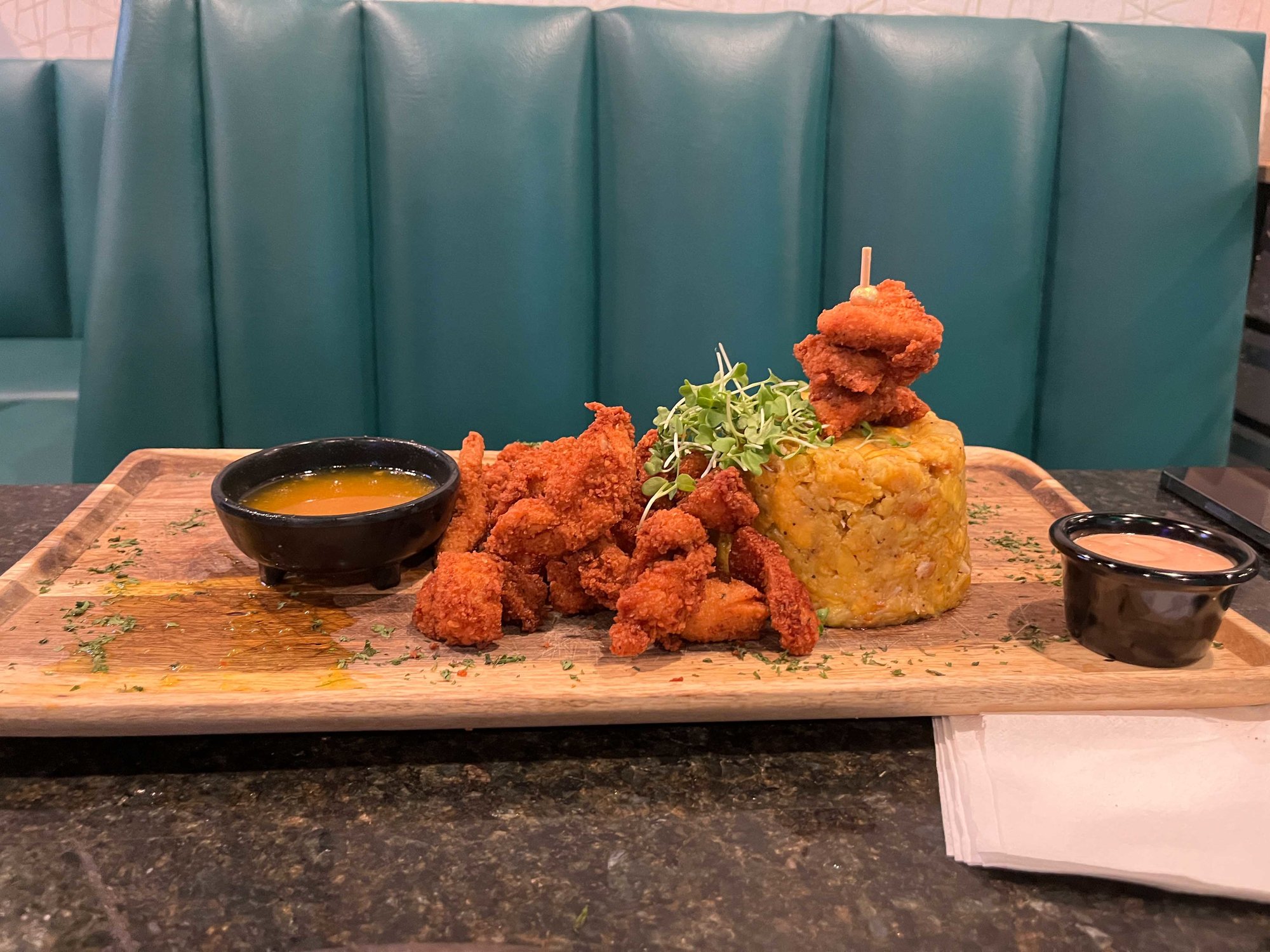chicken mofongo on a rectangluar plate